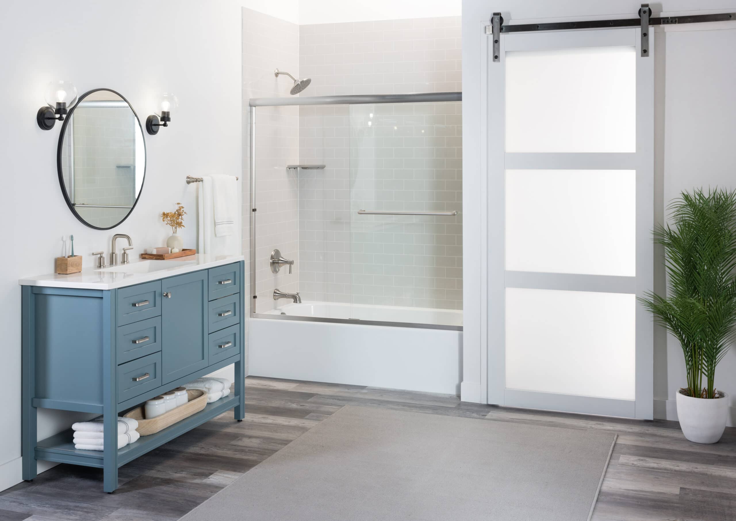 Photo of a tub and shower combo with acrylic shower walls