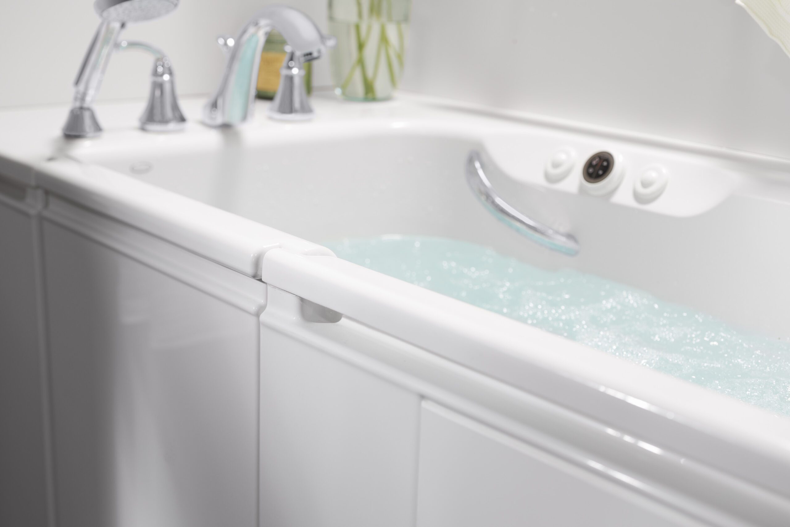 Close up photo of a walk in tub filled with water