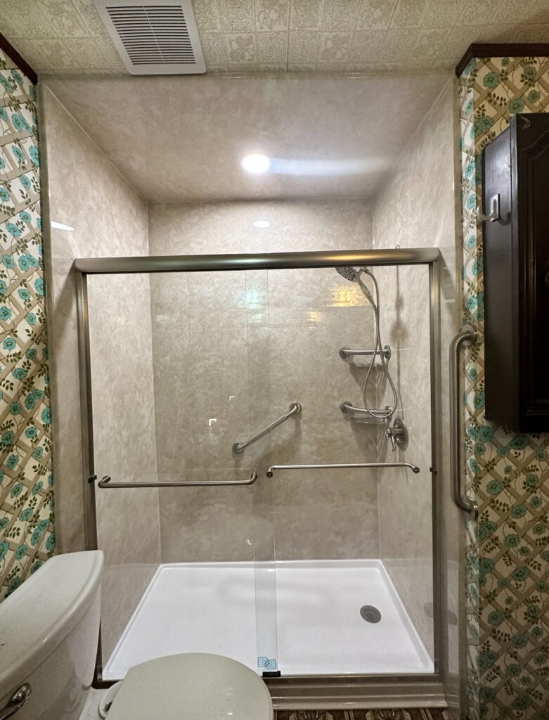 Photo of a new walk in shower in a small bathroom