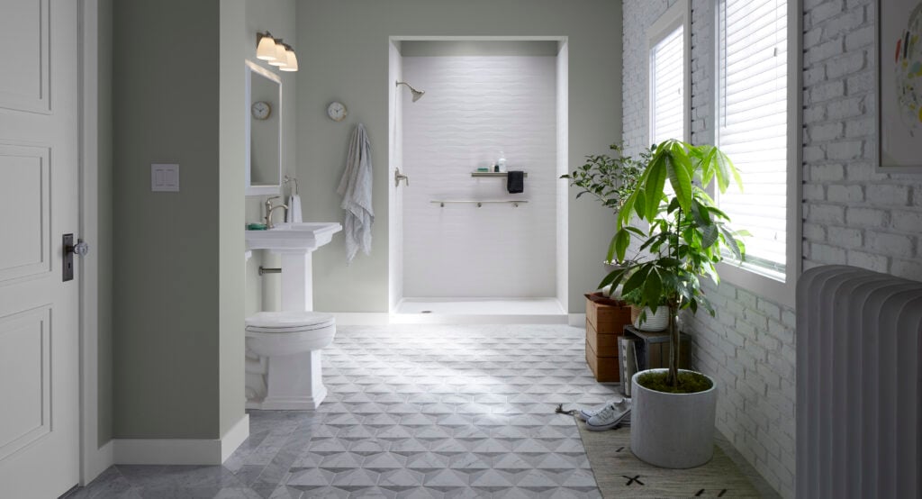 Photo of a clean and attractive bathroom with a brand new Kohler walk in shower