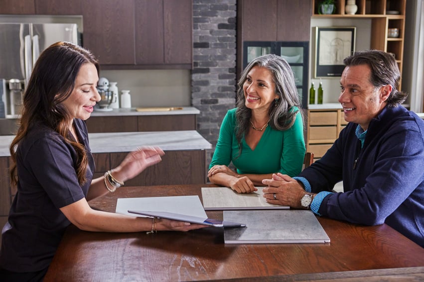Photo of a Jacuzzi salesperson talking to homeowners about their walk in shower cost or bathroom remodel cost