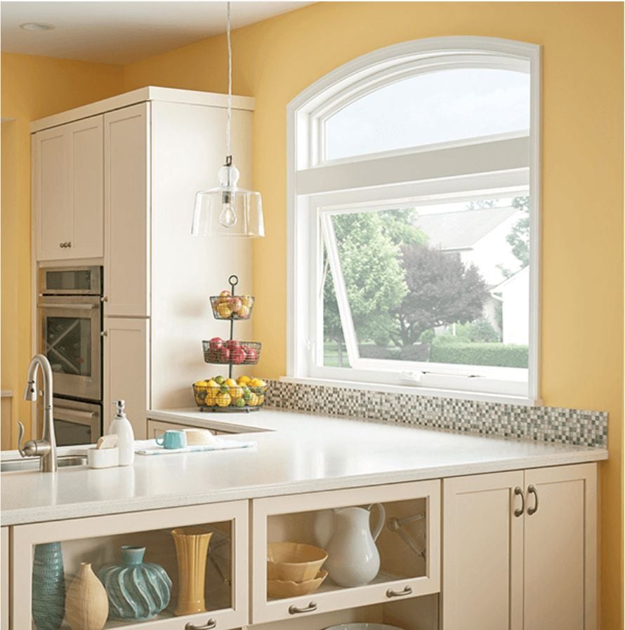 Photo of a kitchen with a transom window above a casement window